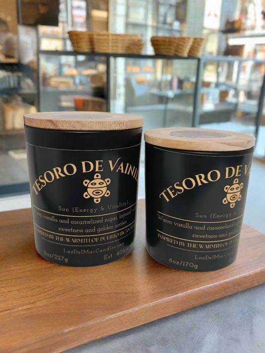 tesoro-de-vainilla-warm-vanilla-candle two different sized candles on a bakery counter